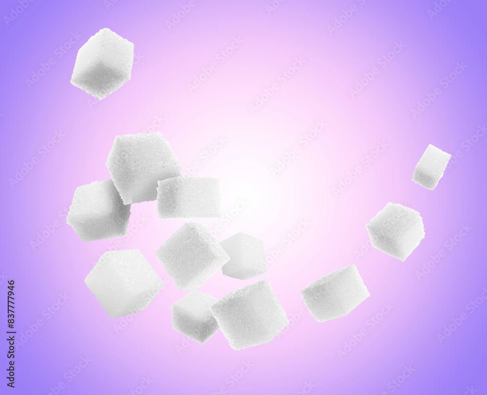 Refined sugar cubes in air on purple gradient background Refined sugar cubes in air on purple gradient background
