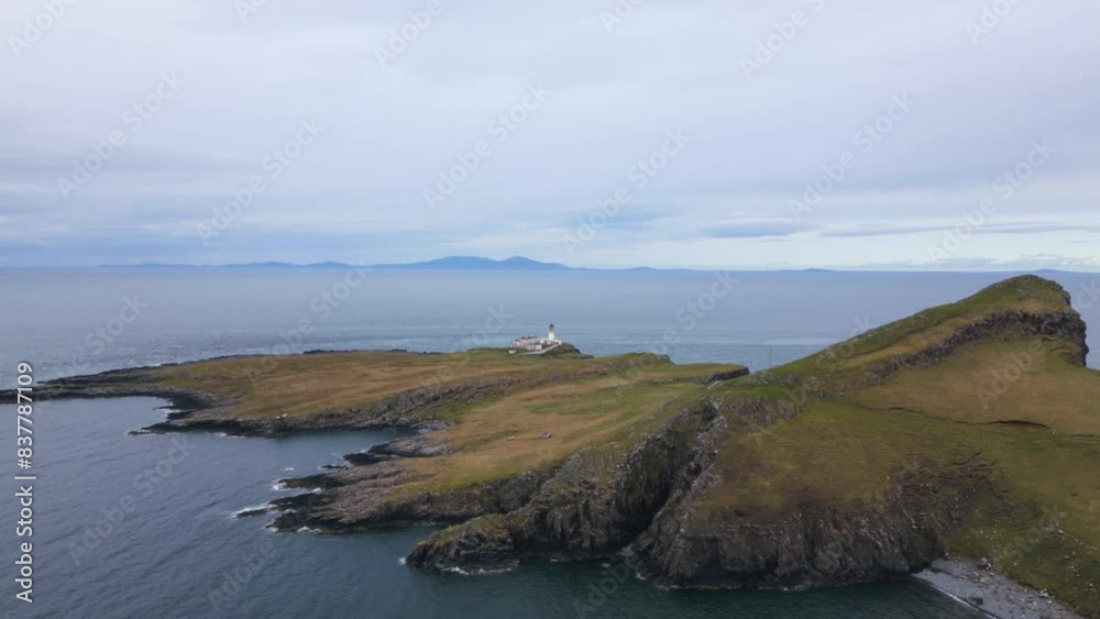 White lighthouse at Neist Point on the highlands of Isle of Skye. Aerial view