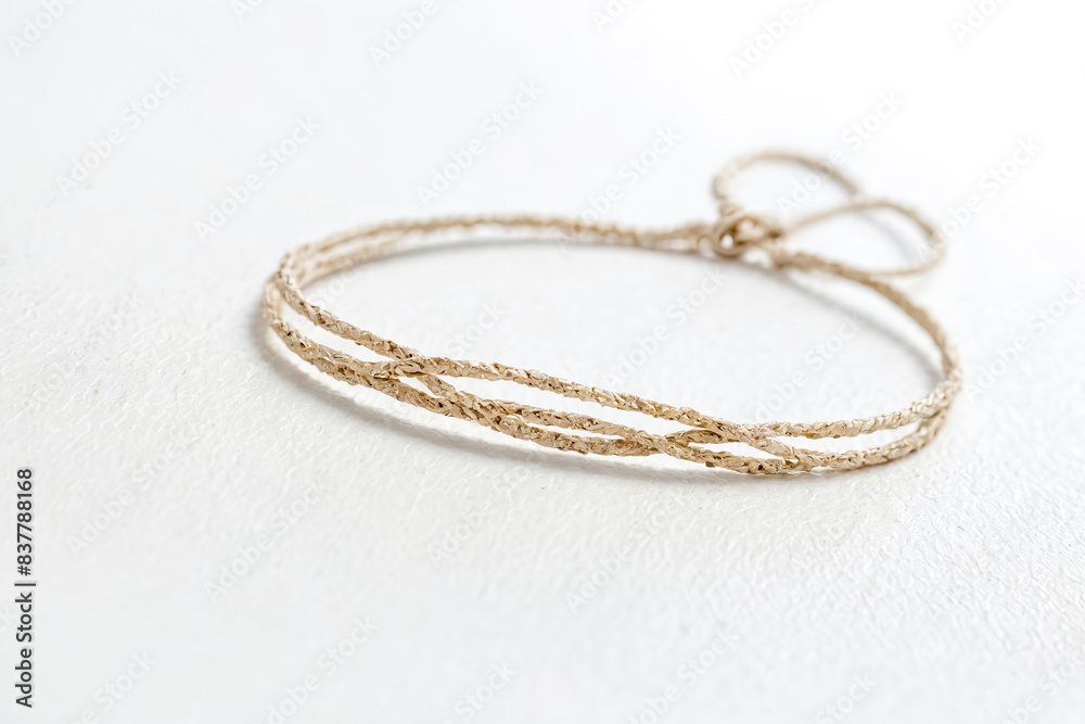 Closeup of a gold braided bracelet Closeup of a gold braided bracelet