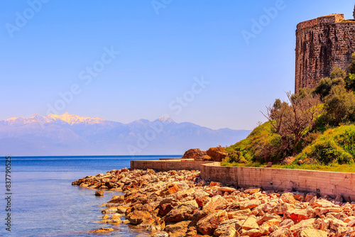 Sea, castle, snow mountains, Peloponnese, Greece photo