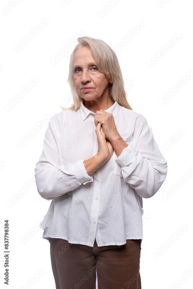 Portrait of an elderly business woman with gray hair in a shirt Portrait of an elderly business woman with gray hair in a shirt