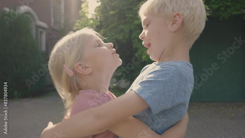 Brother and sister embrace each other