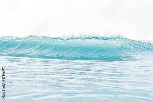 Turquoise Ocean Wave Breaking in Calm Waters