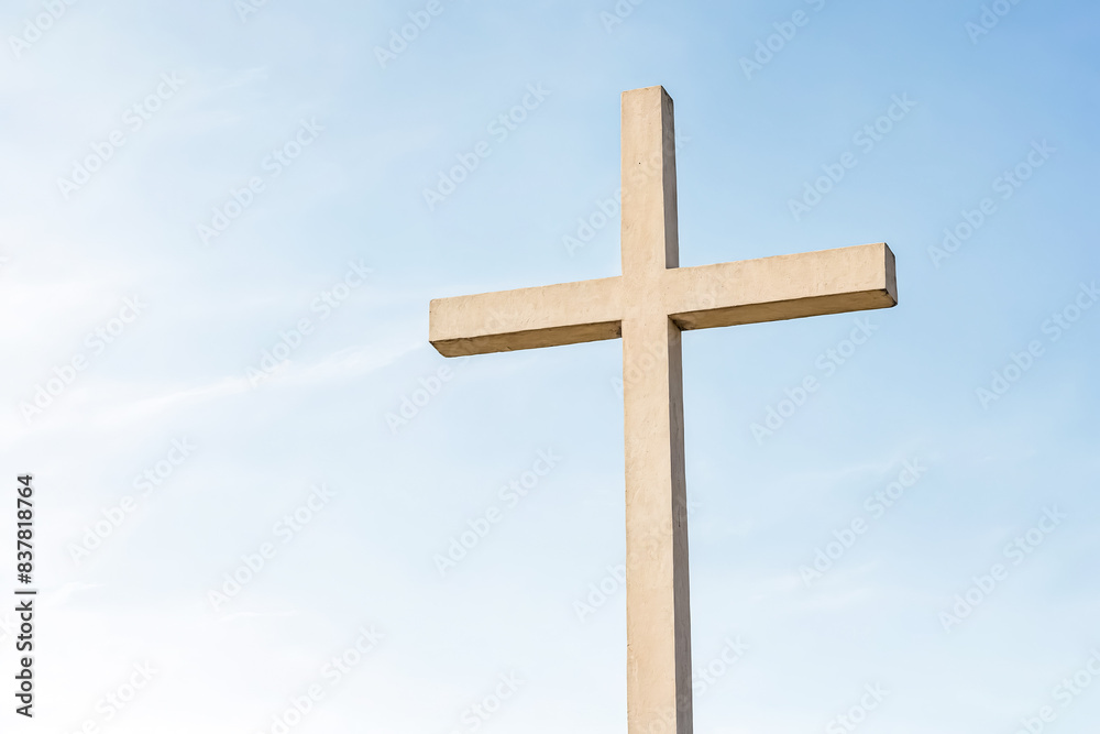 Concrete Cross Against a Blue Sky