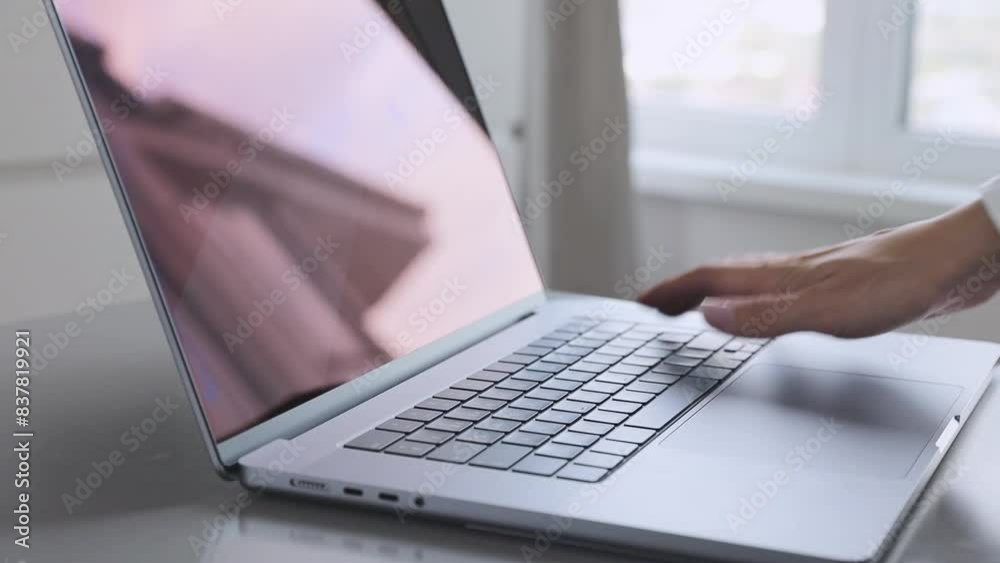 Hand typing on a laptop keyboard, a close up view. Concept of education, technology Hand typing on a laptop keyboard, a close up view. Concept of education, technology