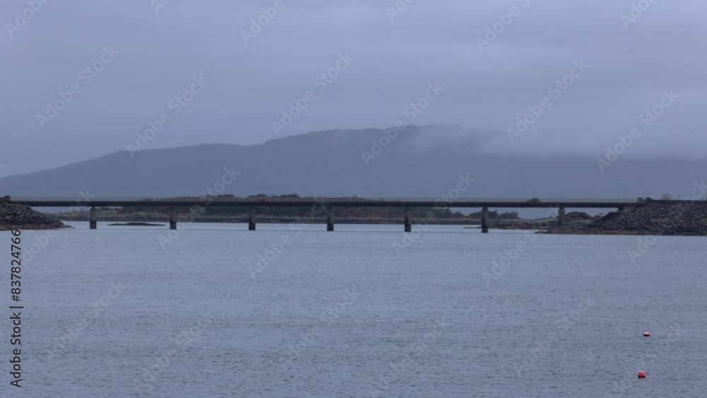 Slow panning shot of the Isle of Skye Roadbridge with cars driving Slow panning shot of the Isle of Skye Roadbridge with cars driving