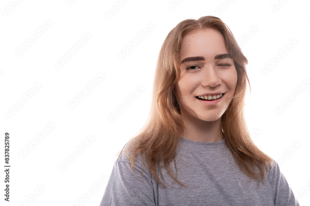 Headshot portrait of laughing teenage girl in gray t-shirt Headshot portrait of laughing teenage girl in gray t-shirt