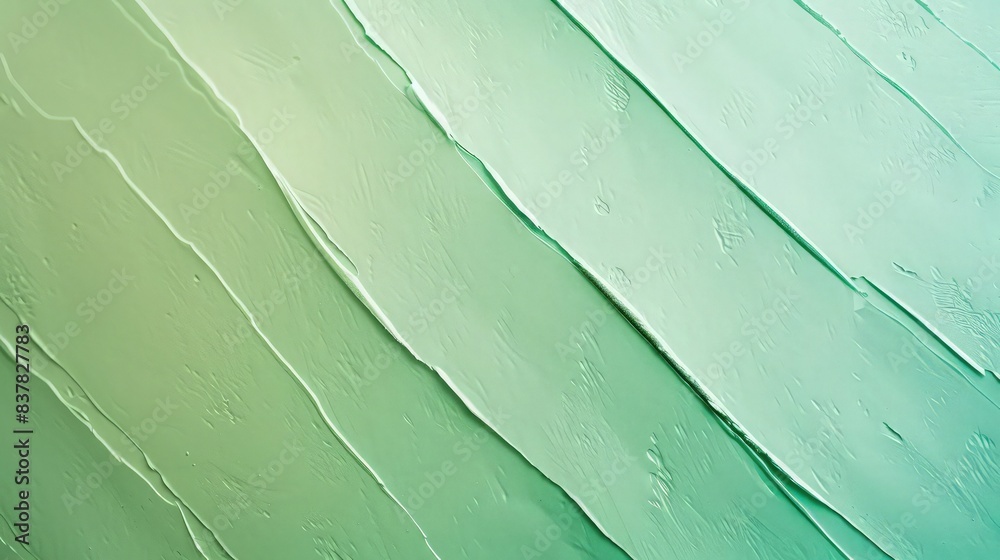Obraz premium Smooth, parallel diagonal swaths of pale green and cool turquoise paint create a minimalist abstract background perfect for contemporary vertical advertisements.