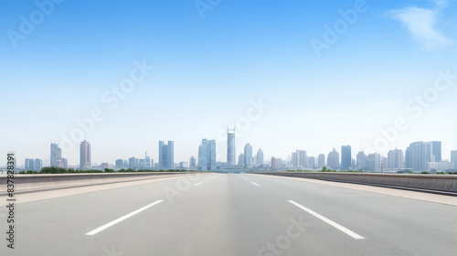 Empty Road Leading to Modern City Skyline