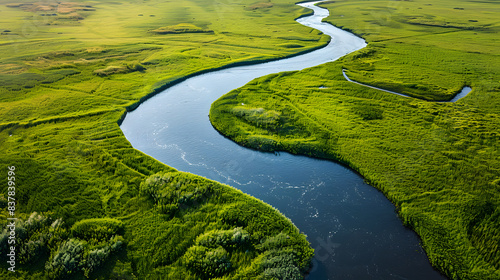 Aerial view of green grassland river valley photo