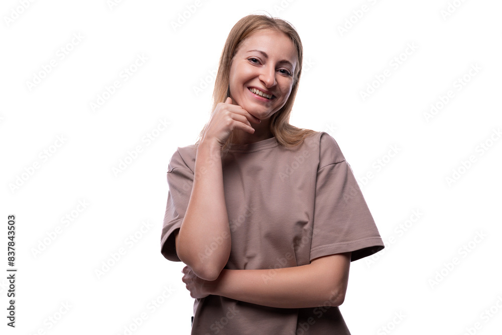 Caucasian blond woman wearing a T-shirt smiling at the camera Caucasian blond woman wearing a T-shirt smiling at the camera