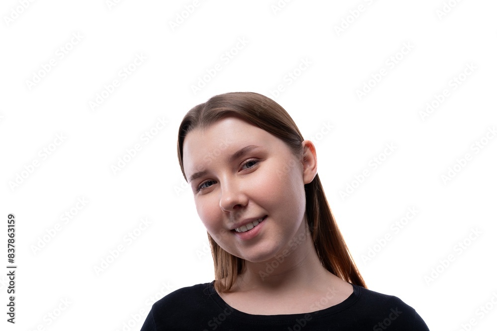 Cute school age girl dressed in black clothes on a white background Cute school age girl dressed in black clothes on a white background