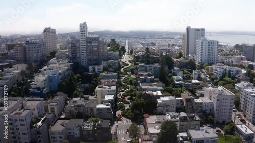 Descending close-up aerial shot of cars going down the famous crooked Lombard Street on Russian Hill in San Francisco, California. 4K