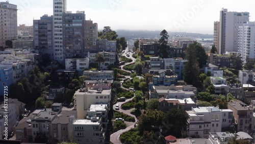 Wide descending aerial shot of the famous crooked Lombard Street on Russian Hill in San Francisco, California. 4K