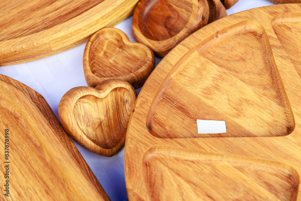 A collection of wooden plates and bowls with hearts on them A collection of wooden plates and bowls with hearts on them