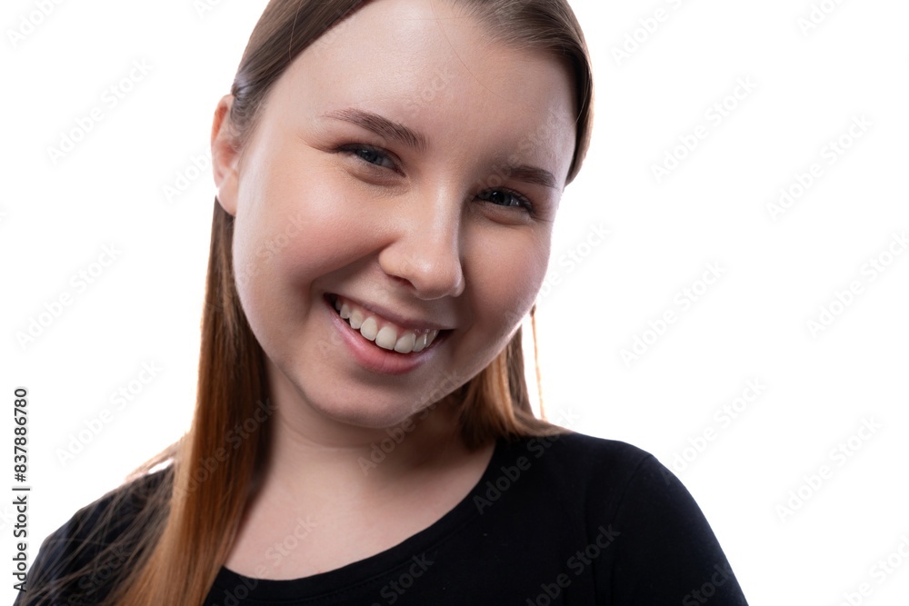 European fair-haired teenage girl dressed in a black turtleneck on a white background with copy space European fair-haired teenage girl dressed in a black turtleneck on a white background with copy space