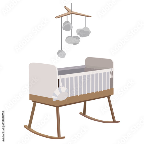 Children's furniture. Ideal for newborns. Children's bed in white colors with a wooden base and a rattle above the bed. Sleeping furniture for small children