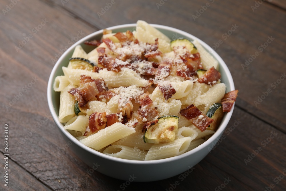 Tasty pasta with bacon and cheese on wooden table, closeup Tasty pasta with bacon and cheese on wooden table, closeup