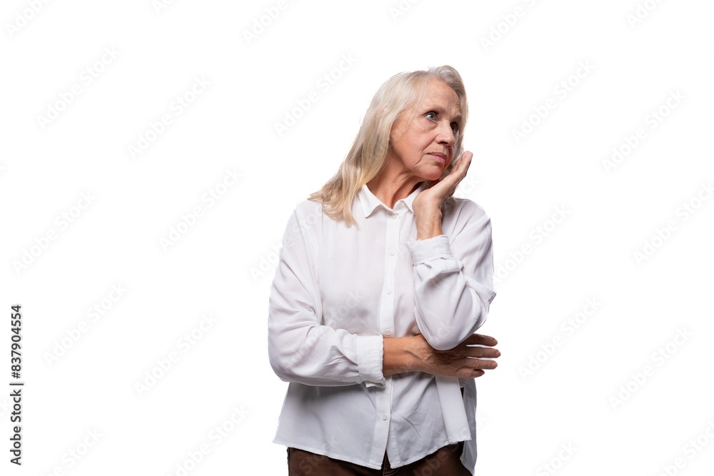Pensioner business woman with gray hair looking to the side Pensioner business woman with gray hair looking to the side