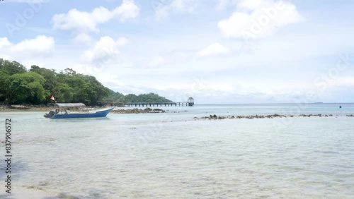 Wooden boat moored, bay location, ocean water ripple, vacation scenery photo