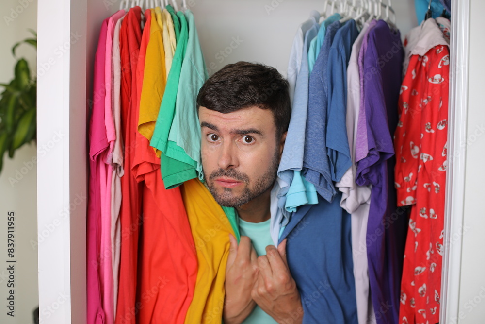 Scared handsome man about to come out of the closet Scared handsome man about to come out of the closet