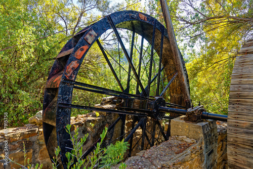 Old cast iron waterwheel mounted on shaft near Van Wyksdorp in the Little Karoo, Western Cape, South Africa photo