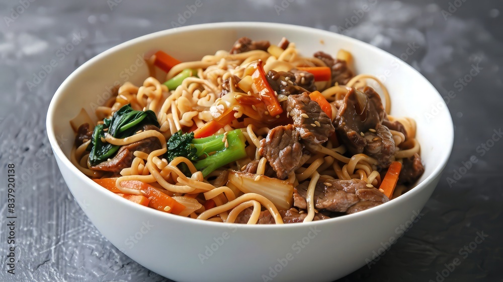 Stir fry noodles with beef and vegetable in white bowl. asian style food. Stir fry noodles with beef and vegetable in white bowl. asian style food.