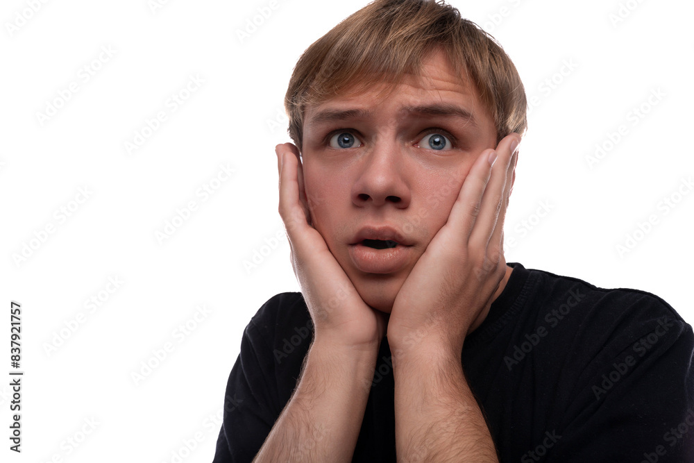 Portrait of a teenage guy with blond hair having problems Portrait of a teenage guy with blond hair having problems