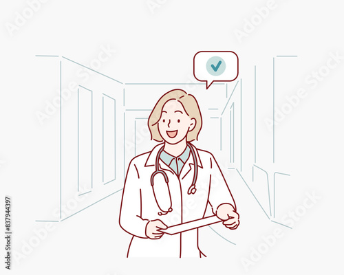 Female doctor using tablet computer in hospital lobby. Hand drawn style vector design illustrations.