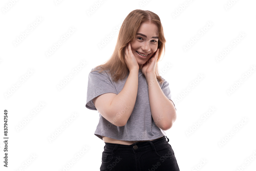 Modest teenage girl with blond hair and braces on a white background Modest teenage girl with blond hair and braces on a white background