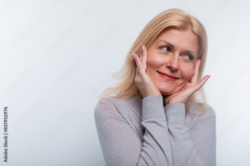 European woman with blond hair behaves modestly in the studio European woman with blond hair behaves modestly in the studio