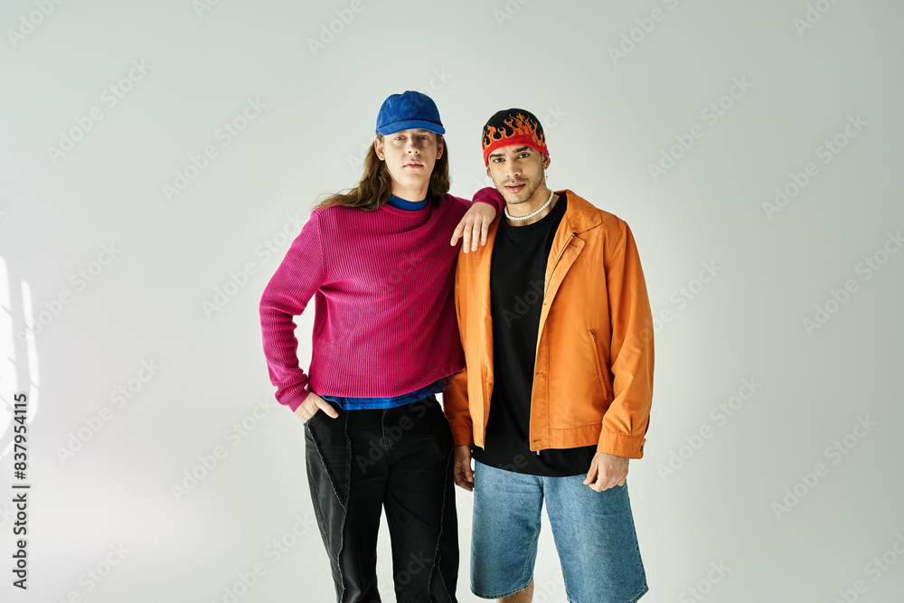 Two men standing closely next to each other. Two men standing closely next to each other.