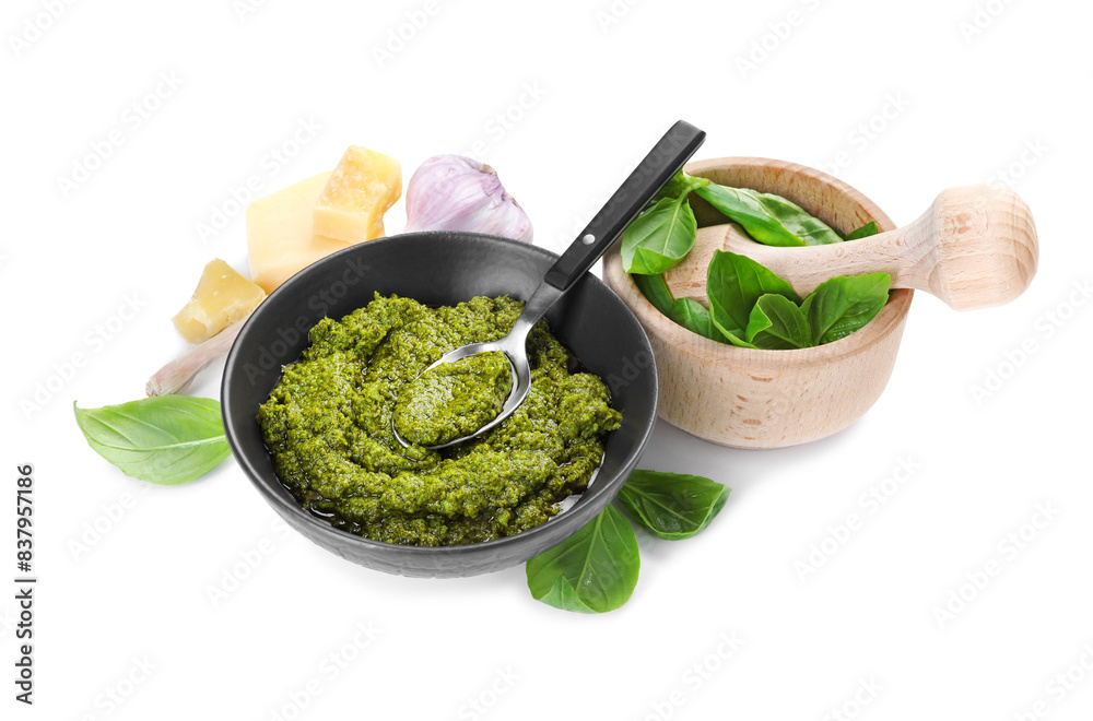 Fresh tasty pesto sauce and ingredients isolated on white