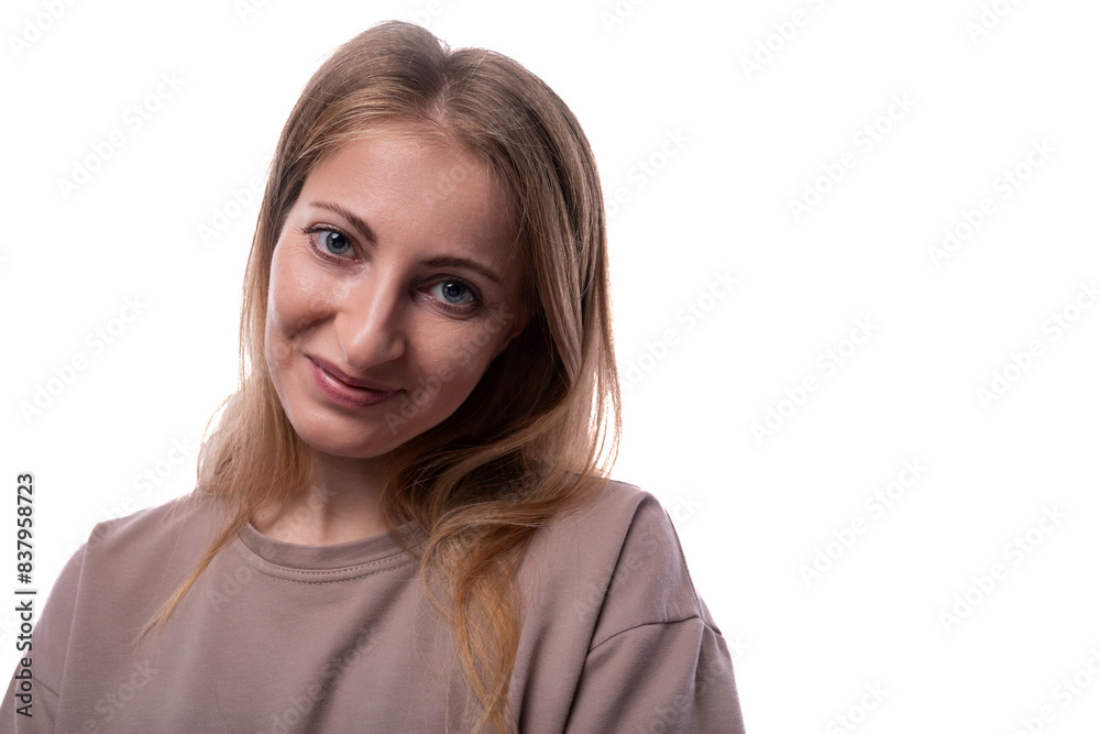 Shy adult woman with blond hair on a white background with copy space Shy adult woman with blond hair on a white background with copy space