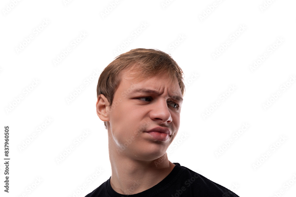 Fototapeta premium Headshot portrait of embarrassed handsome blond teenager guy