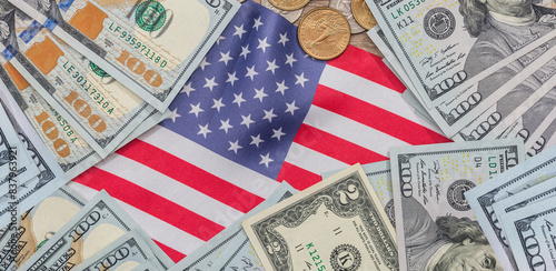 paper US dollar and coin cent on National USA flag