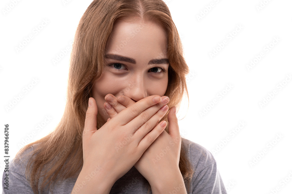 Modest teenage girl with blond hair and braces on a white background Modest teenage girl with blond hair and braces on a white background