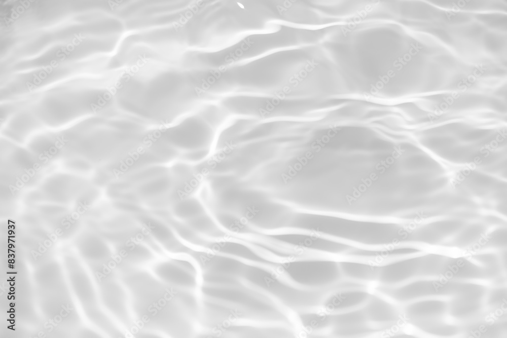 White water with ripples on the surface. Defocus blurred transparent white colored clear calm water surface texture with splashes and bubbles. Water waves with shining pattern texture background. White water with ripples on the surface. Defocus blurred transparent white colored clear calm water surface texture with splashes and bubbles. Water waves with shining pattern texture background.