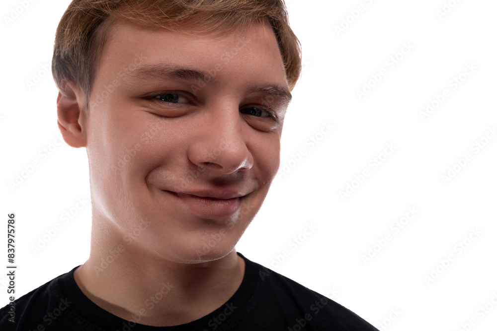 Obraz premium Cute fair-haired teenager guy on a white background, close-up portrait