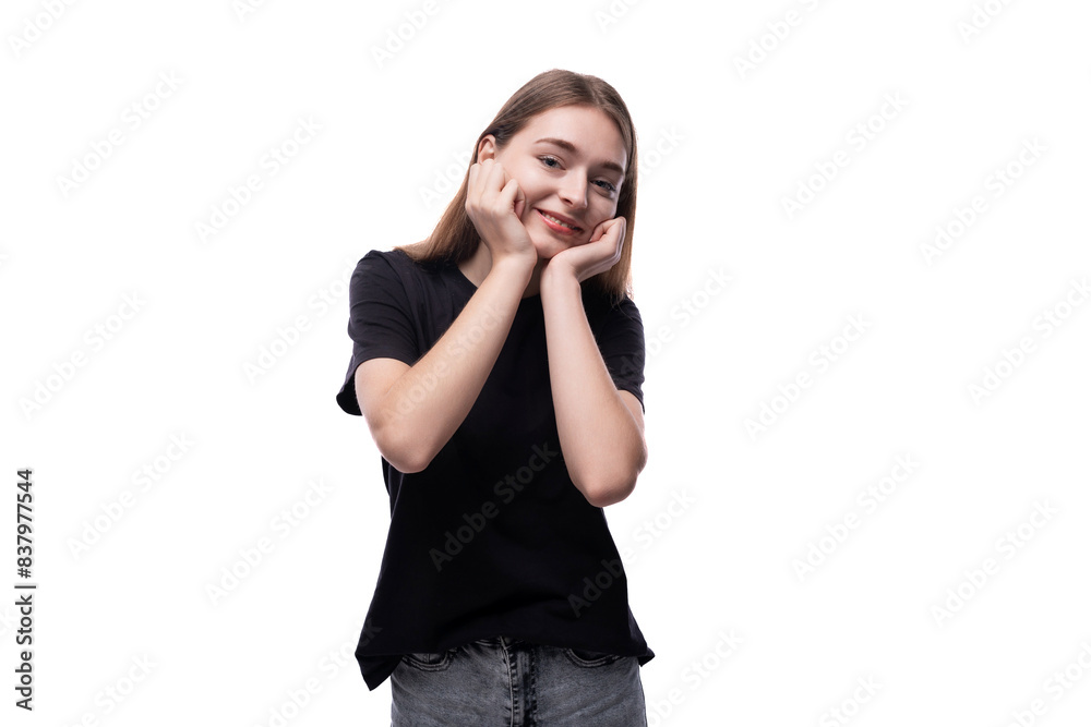 Charming fair-haired teenage girl in a black T-shirt on a white background Charming fair-haired teenage girl in a black T-shirt on a white background