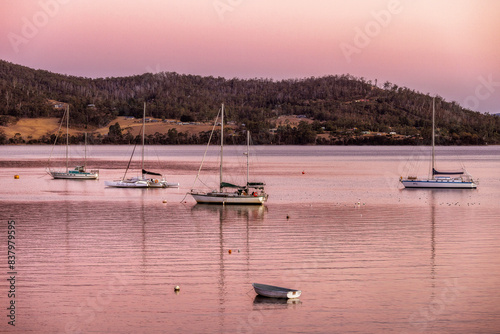 Boats at dusk at Port Huon, Tasmania, Australia photo