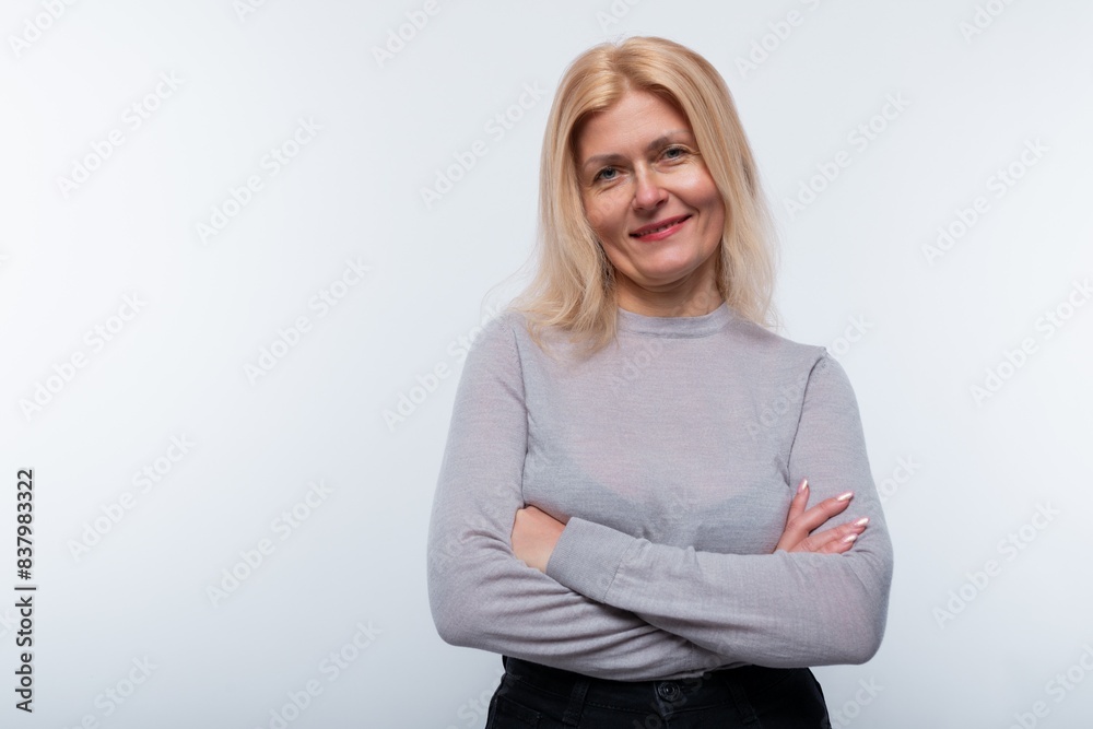 European woman with blond hair is confident in herself on a white background European woman with blond hair is confident in herself on a white background