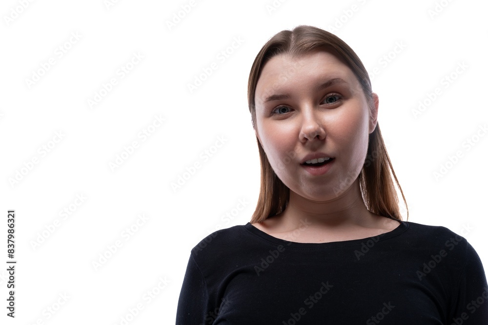 Emotional portrait of a schoolgirl with blond hair in a black turtleneck on a white background Emotional portrait of a schoolgirl with blond hair in a black turtleneck on a white background