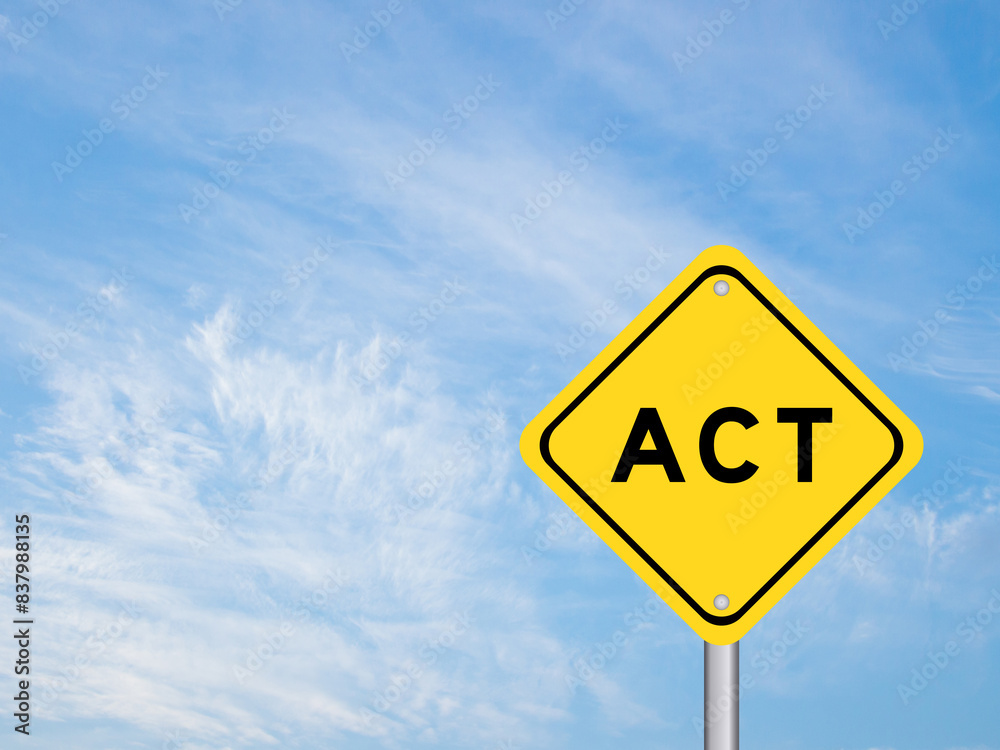 Yellow transportation sign with word act on blue color sky background Yellow transportation sign with word act on blue color sky background