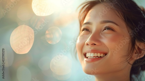 A beautiful Asian woman with clear skin is smiling