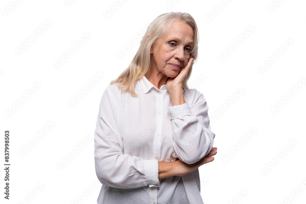 An elderly business woman with gray hair thought An elderly business woman with gray hair thought