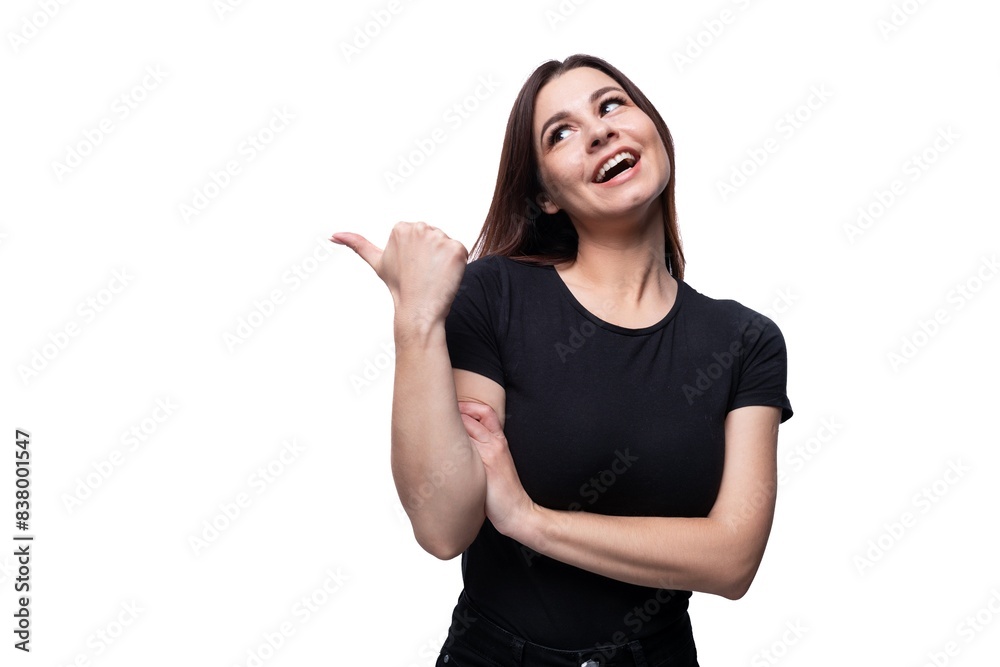Young smiling european woman dressed in basic t-shirt pointing with finger Young smiling european woman dressed in basic t-shirt pointing with finger