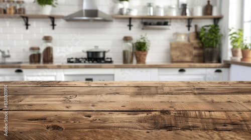 Rustic wooden table top with a blurred modern kitchen interior