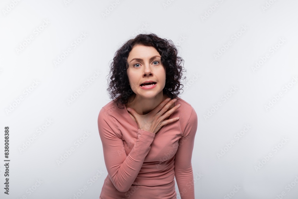 Fototapeta premium Cute brunette curly woman has mixed feelings