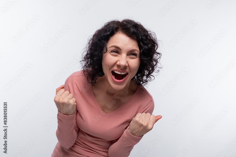 Portrait of screaming happy curly woman with short hair Portrait of screaming happy curly woman with short hair